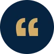 Dark blue circular icon featuring beige quotation mark symbols in the center.